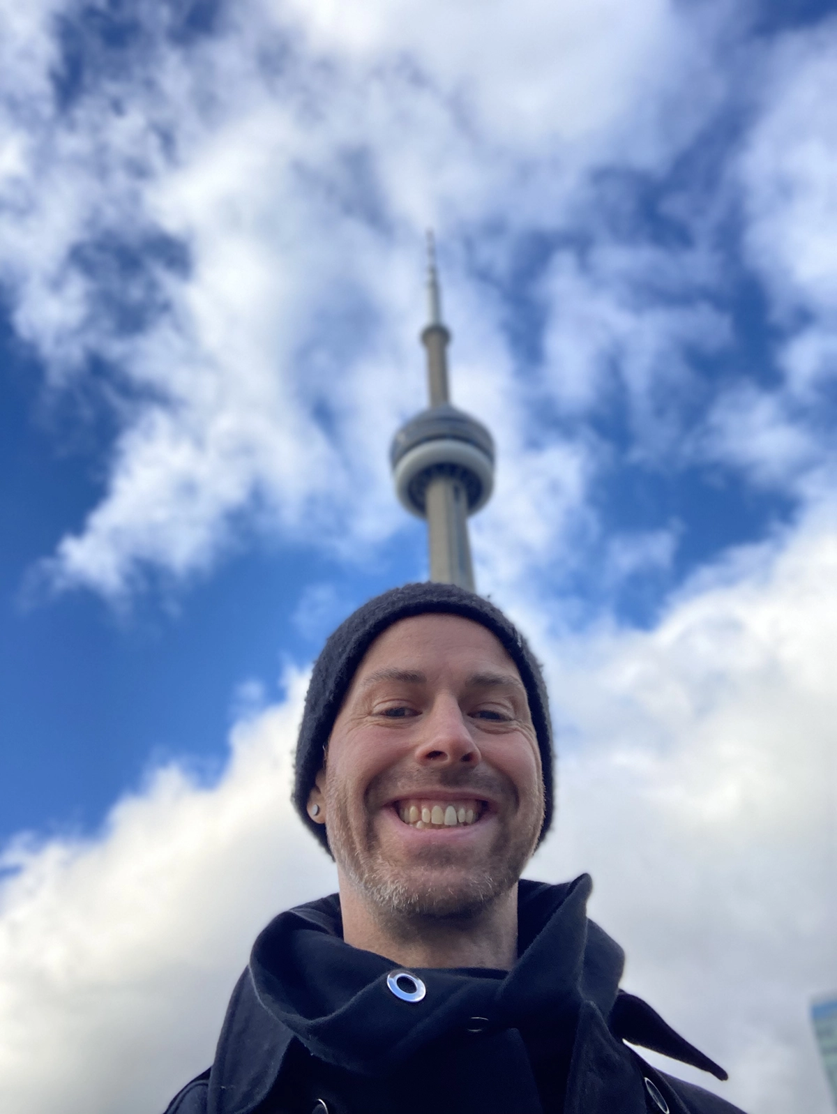 DJ Jamieson in front of the CN Tower in Toronto.